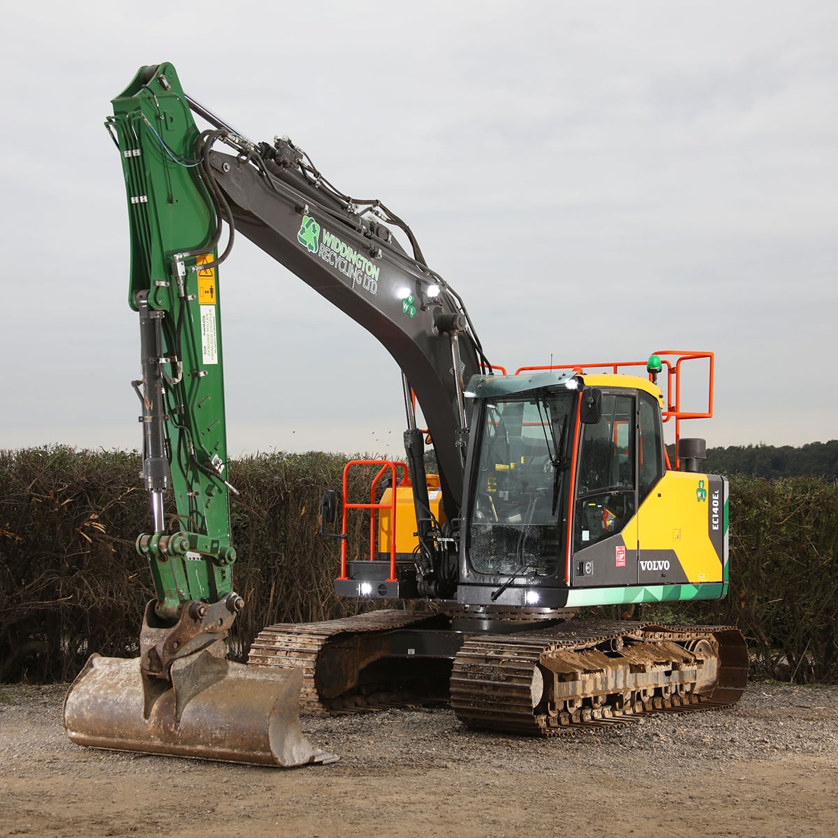 Image of a branded excavator for hire from widdington recycling.